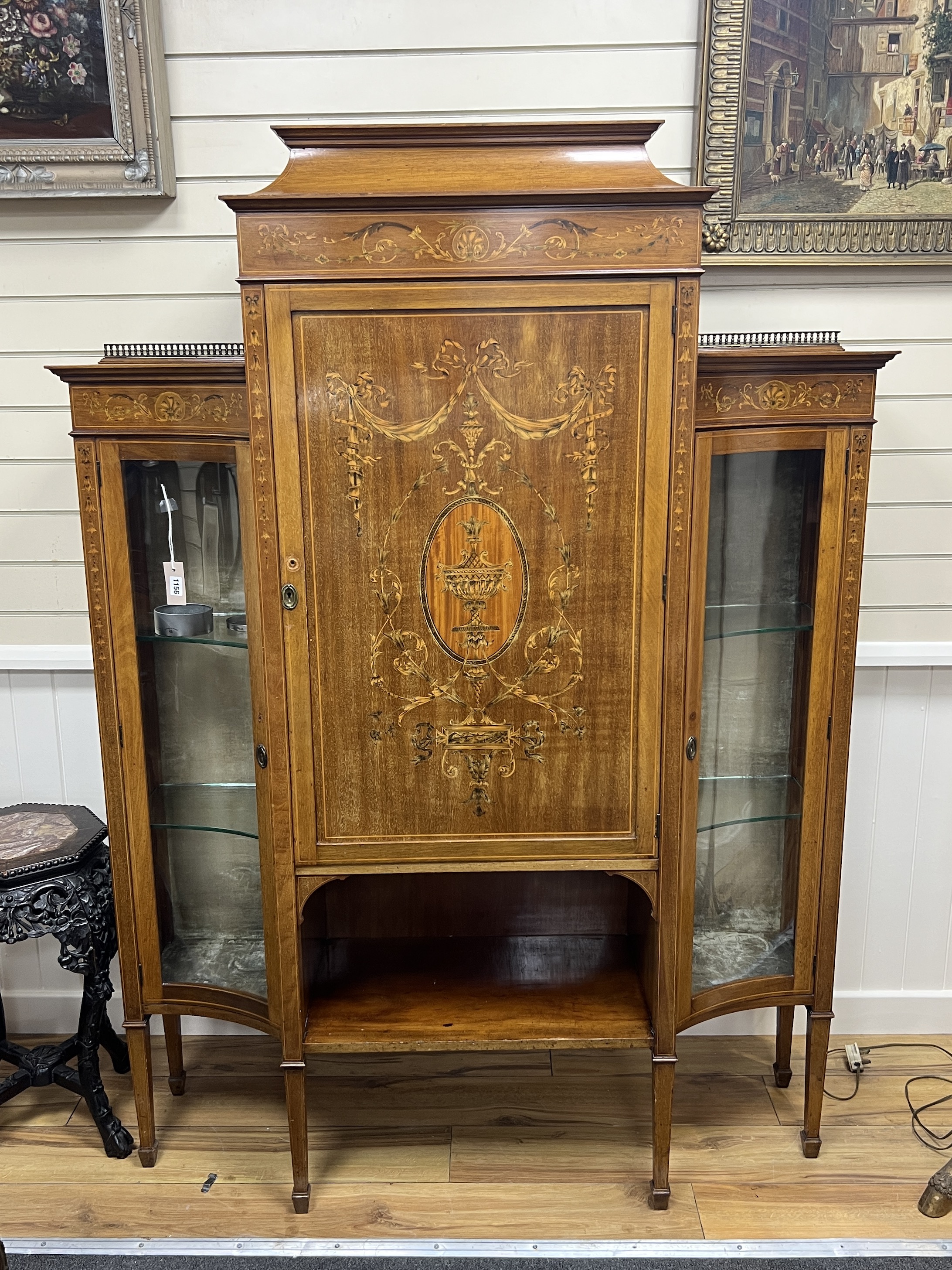 An Edwardian marquetry inlaid mahogany side cabinet, width 172cm, depth 38cm, height 177cm